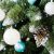 Close-up of Royal Trees Diamond Fir Christmas Tree with white and blue ornaments