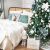 Royal Trees Diamond Fir Christmas Tree with decorations in a bedroom setting