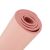 Close-up of rolled pink yoga mat