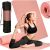 Woman using pink yoga mat with carrying bag and rolled mat