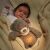Baby sleeping with Nattou Sleepy Bear Grey Musical Night Light Plush Toy