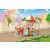 Sylvanian Families Popcorn-Liefer-Dreirad mit Schaf-Mutter Barbara in einer Parklandschaft
