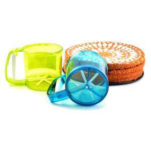 Green and blue plastic powder sugar shakers with handle, on white background - Spice Rack