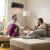 Couple enjoying the warmth of Bewello BW2103A Wifi Wall Heater