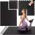 Woman exercising on Springos black puzzle exercise mat