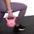 Woman using Springos black puzzle exercise mat with kettlebell