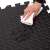 Close up of Springos black puzzle exercise mat showing water resistance