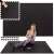 Woman exercising on Springos black puzzle exercise mat