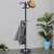 Springos coat rack with marble base and umbrella stand in a living room setting