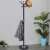 Springos free-standing coat rack with marble base and umbrella holder, black, in a home setting