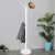 Springos white coat rack with marble base, hat and jacket on hooks, in room setting