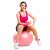 woman using Springos 75 cm pink exercise ball for workout with dumbbells