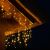 Close-up of Fényfüggöny 500 LED warm white icicle lights on a roof