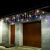 Fényfüggöny 300 LED multicolor icicle lights on garage