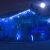 House decorated with blue Icicle LED lights at night