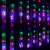 Springos star curtain lights, 136 LED, multicolor, hanging on a window, with a curtain