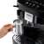 DeLonghi Magnifica Evo ECAM290.22.B coffee maker with milk frother, making a cappuccino