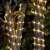 Timeless Tools solar powered LED light string wrapped around a tree, warm white, 10 meters long, 8 lighting modes