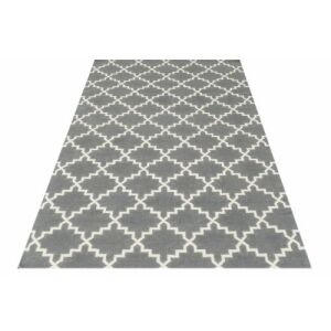 Schräge Ansicht des grauen Bakero Kelim Eugenie Teppichs (155x240 cm) - Innenarchitektur