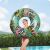 Girl holding Bestway Floral Fantasy swim ring outdoors