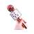 Hand holding rose gold wireless karaoke microphone with built-in speaker