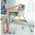 Baby eating in Pepita Happy high chair with storage basket