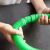 Close-up of hands connecting green Kruzzel pop tube sensory toy