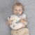 Baby lying with Chicco Dorombolós Plush Cat - Comfort Toy