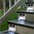 Silver solar powered LED step lights installed on stairs
