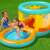 Kids playing in the Bestway Jumptopia inflatable bounce house with pool