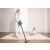 Woman using Dreame V11 cordless vacuum cleaner at home