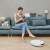 Dreame F9 Robot Vacuum Cleaner cleaning while woman relaxes