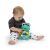 Baby playing with Baby Einstein Neptune's Sensory Sidekick Turtle on white background
