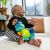 Baba ül és játszik a Baby Einstein Neptune's Sensory Sidekick teknőssel