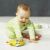 Baby playing with Skip Hop bee drum, fox tambourine, and bee rattle