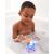 Boy playing with Skip Hop Narwhal ring toss bath toy