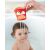 Child playing with Skip Hop Zoo Fox Stack & Pour Bucket in the bath, pouring water
