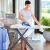 Woman ironing on Tescoma FANCY HOME ironing board