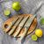 Tescoma MicroBlade MOVE paring knives set on wooden board with fruits
