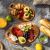 Tescoma FEELWOOD oval serving and cutting boards with pastries, fruits, and charcuterie