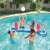 People playing volleyball on Bestway inflatable volleyball set in a pool