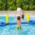 Kids playing volleyball on Bestway inflatable volleyball set in a pool
