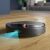 Philips Seria 7000 Aqua XU7000/01 robot vacuum cleaner in action, cleaning hardwood floor
