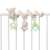 babyFEHN plush spiral seahorse toy attached to a crib rail
