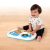 Baby playing with the Baby Einstein Musical Mix 'N Roll 4-in-1 Activity Walker
