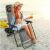 Woman enjoying Pepita Zero Gravity Relax Chair on the beach