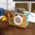 Baby Einstein Learning Lens Interactive Camera Toy, Hape, being used by a child, showing the shutter button
