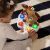 Infant playing with Baby Einstein Drum & Learn Dean musical toy