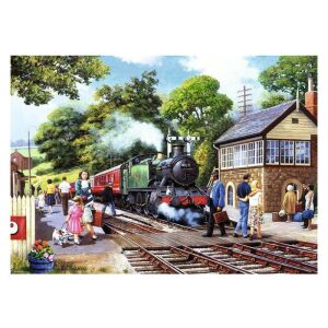 Puzzle cu 1000 de piese cu o gară de tren din țară cu o locomotivă cu abur, oameni și un câine - Ravensburger Puzzle