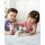 Two children playing with SKIP HOP Zoo Sweet Scoops Ice Cream Stacking Set with Color Changing Scoops, Unicorn, and Rainbow Stand
